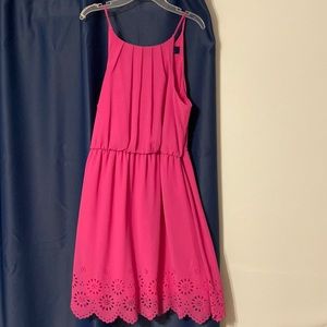 Fuchsia dress with design cut outs at the bottom